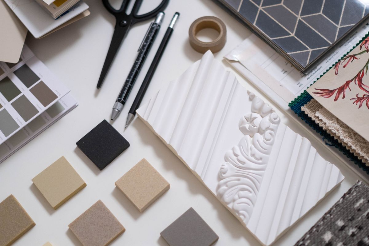 Fabric and colour samples arranged on a design worktable